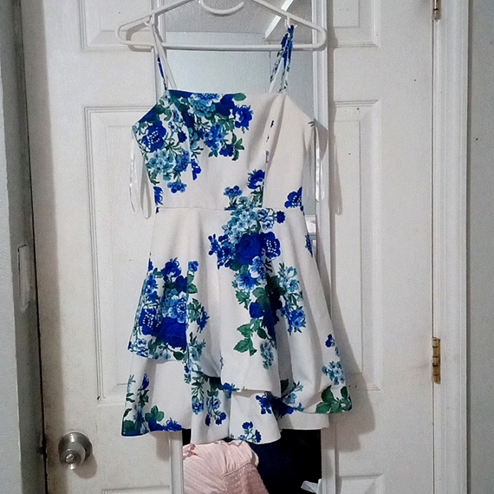 A white dress wiith floral design
